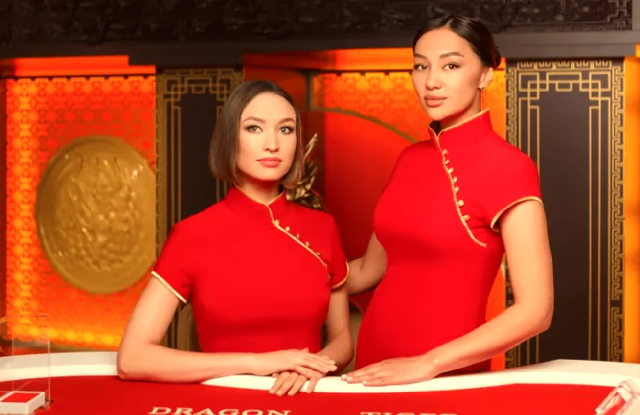 Live dealers in a luxurious gold-themed setting for Dragon Tiger